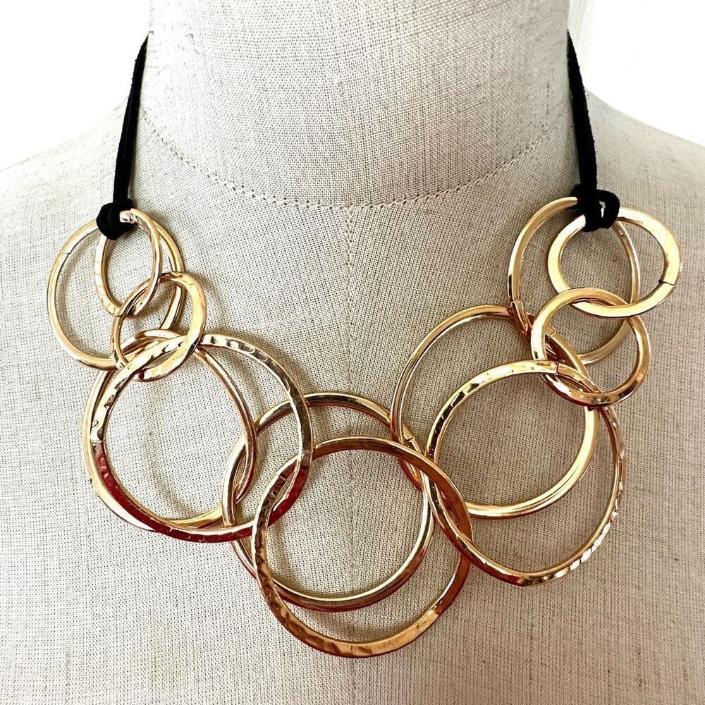Gold tone hammered rings statement necklace